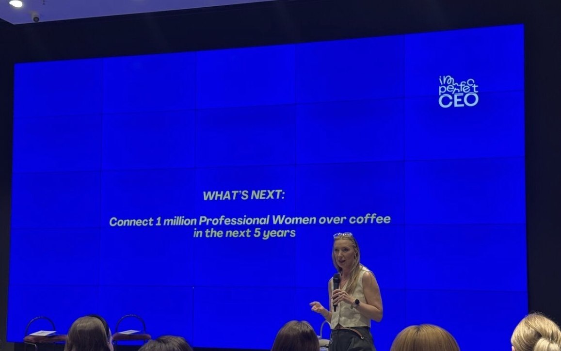 Martina Tararuj on stage in front of a slide reading: connect 1 million professional women over coffee in the next 5 years